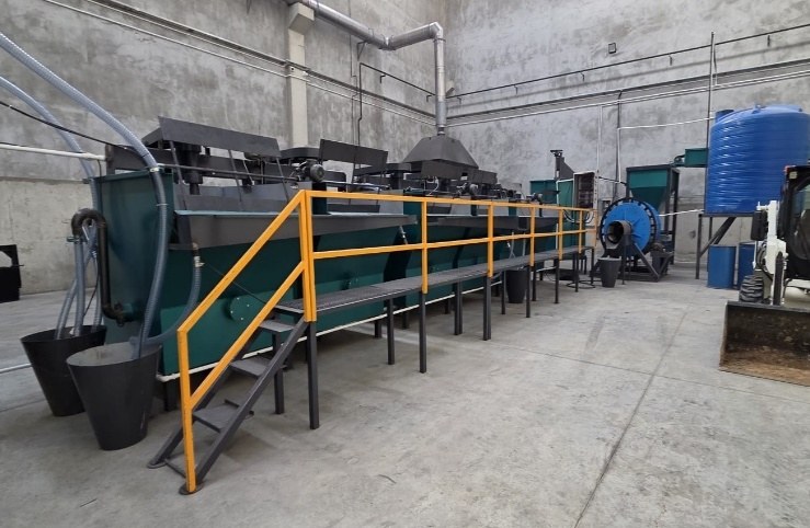 Indoor flotation line with yellow safety railings and process cells