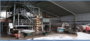 Interior of a mineral-processing plant with multi-level steelwork and process equipment